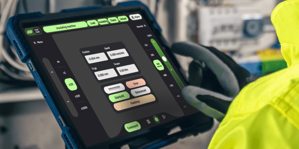 Line operator holding an ARIA industrial HMI tablet