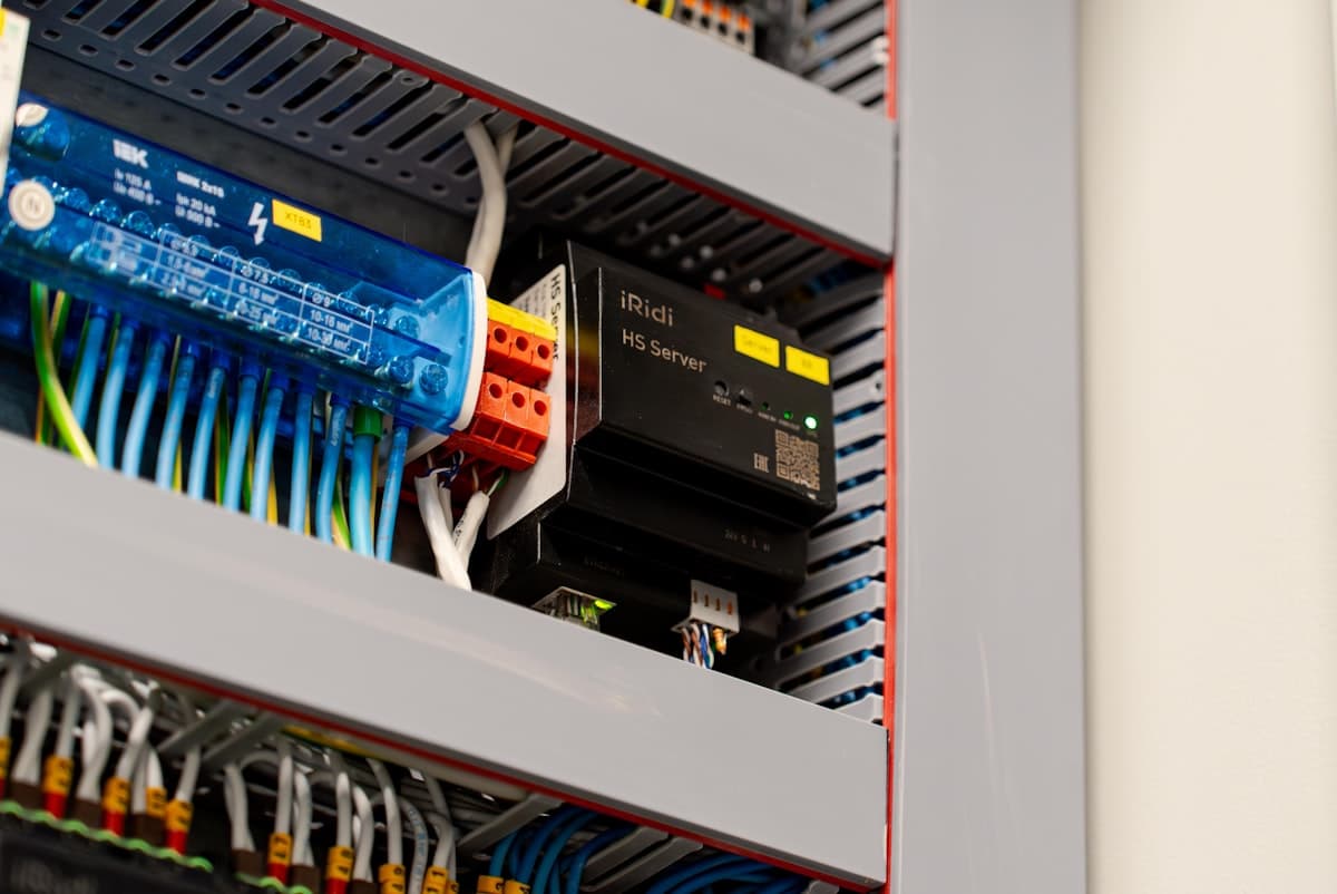 Industrial control cabinet with terminal blocks, wiring, and a server module