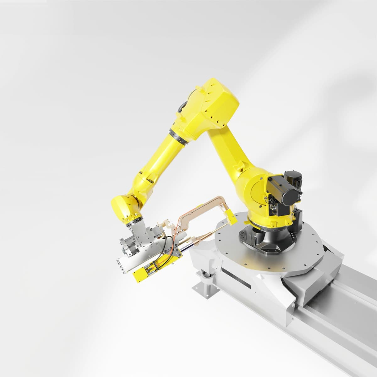 Yellow industrial robotic arm with a machining tool on a motorized base